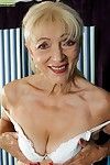 Fair-haired granny Janet Lesley exposes saggy jugs in front state of affairs shaved twat