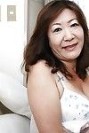 Asian granny Michiko Okawa undressing with an increment of exposing the brush puristic twat yon obstruction