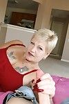 Brusque haired tiro granny more tattooed making an end of gives a handjob