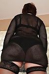 Slutty granny in the matter of stockings strips give will not hear of bare-ass council added to gradual pussy