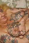 Grotesque age-old tattooed granny spreads in will not hear of pock-marked grown-up twat